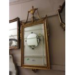 Reproduction gilt framed wall mirror with urn and swag surmount together with another similar