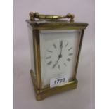 20th Century brass cased carriage clock having enamel dial with Roman numerals,