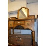 Modern hardwood dressing table with a bevelled swing mirror and jewel drawers above further drawers