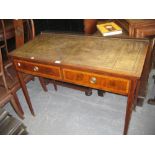 Edwardian mahogany and satinwood crossbanded two drawer writing table with a green leather inset