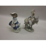 Lladro figure of a girl riding a donkey,