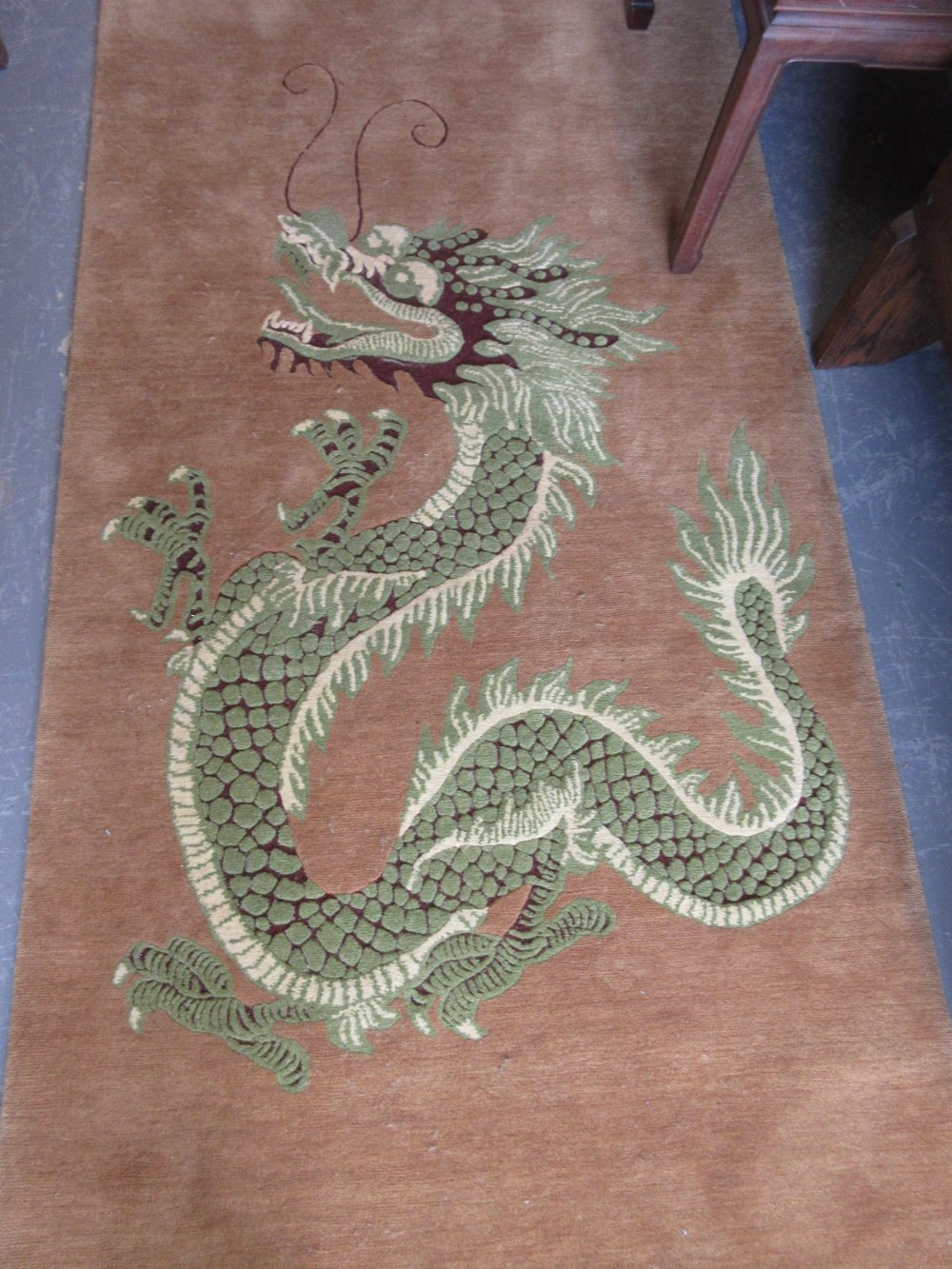 Modern Nepalese rug with dragon design on a beige ground