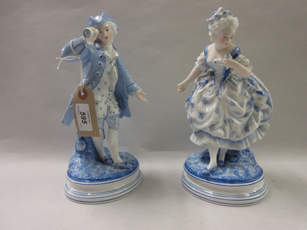 Pair of French blue and white porcelain figures of a lady and gentleman (one a/f)