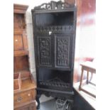 19th Century carved dark oak standing corner cabinet on cabriole claw and ball supports