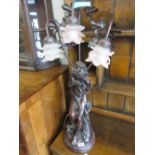 Reproduction bronzed composition three light figural table lamp