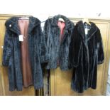 Two three quarter length simulated fur coats and a jacket,