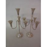 Pair of 20th Century silver plated four light candelabra with barley twist arms and supports on