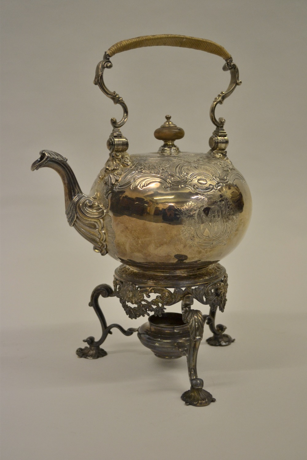 George II silver spirit kettle on stand with embossed and engraved floral and C-scroll decoration
