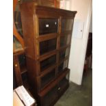 Minty sectional oak bookcase with five pairs of glazed doors on a plinth base