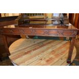 Reproduction square mahogany coffee table with a blind fretted frieze raised on square chamfered