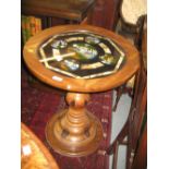 South American circular pedestal table with a glass inset top decorated with views of Rio de