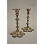 Pair George II cast silver baluster form candlesticks with engraved family crest, London 1751,