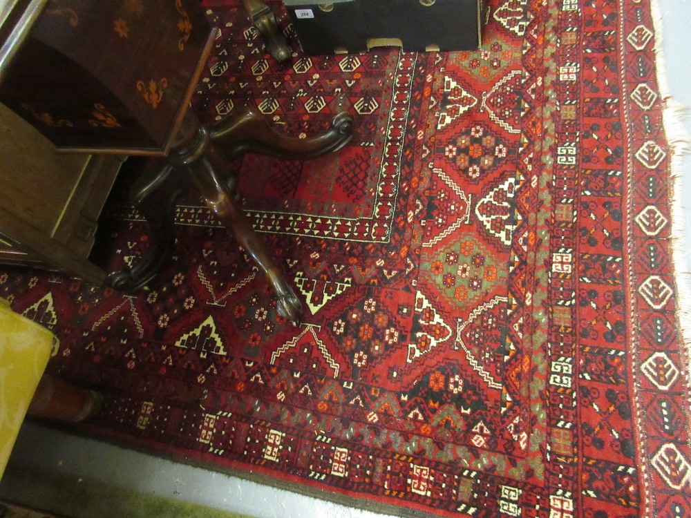 Turkoman rug having twin medallion design on red ground with multiple borders, 7.