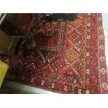 Turkoman rug having twin medallion design on red ground with multiple borders, 7.