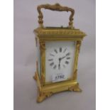 Ornate 19th Century gilt brass cased carriage clock with acanthus leaf mounted and fluted corner