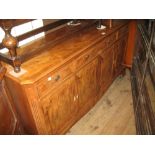 Good quality reproduction yew wood sideboard with three drawers above four cupboard doors on