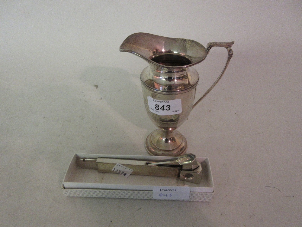 Elizabeth II Birmingham silver pedestal cream jug together with a silver mounted cigar piercer