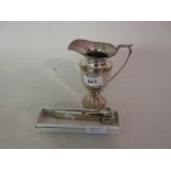 Elizabeth II Birmingham silver pedestal cream jug together with a silver mounted cigar piercer