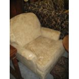 Modern figured floral moquette upholstered armchair on turned front supports