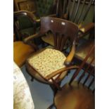 Early 20th Century oak office chair with a moulded panel seat raised on cabriole front supports