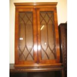 Reproduction yew wood two door wall cabinet with bar glazed door