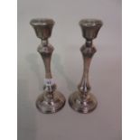 Pair of 20th Century circular Birmingham silver candlesticks,