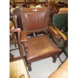 Late Victorian oak brown leather upholstered open elbow chair