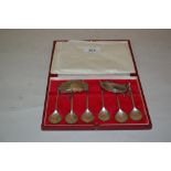 Cased set of six London silver coffee spoons together with two silver decanter labels