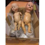 Two small German bisque headed baby dolls with papier mache bodies (a/f),