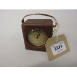 Small 1930's gilt brass cased travel alarm clock by Zenith in a fabric covered travel case