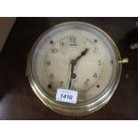 Mid 20th Century brass cased ships clock with painted dial and single train movement inscribed