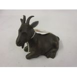 Small brown patinated bronze figure of a goat (possibly Russian)