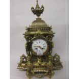 Large 19th Century French gilt brass mantel clock of ornate pagoda design with an urn surmount
