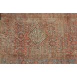 Large Hamadan carpet with a central medallion and all-over Herati design on a brick red ground with