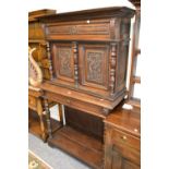 19th Century Flemish oak side cabinet with a moulded cornice above a pair of carved panelled doors,