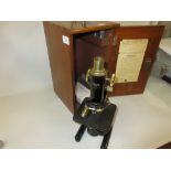 Mahogany cased black Japanned and brass microscope