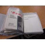 Black folder containing a collection of various theatre programmes,