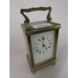 20th Century brass cased carriage clock having enamel dial with Roman numerals and single train