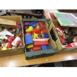 Three boxes containing a large quantity of various plastic and other toys