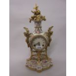 Reproduction French style gilt metal mounted floral painted porcelain two train mantel clock