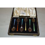 Cased set of six English hallmarked coloured enamel spoons, makers mark H.C.D.