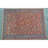 Good Hamadan carpet with an all-over stylised floral design on a brick red ground with multiple