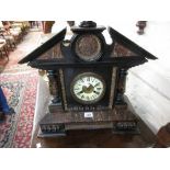 Large 19th Century American faux marble cased mantel clock with circular dial having Roman numerals,