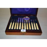 Cased set of twelve Sheffield silver bladed dessert knives and forks together with a small