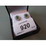 Pair of 18ct white gold circular emerald and diamond cluster ear studs