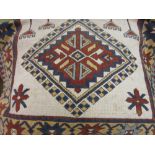 Modern Turkish rug with twin medallion design on an ivory ground with borders,