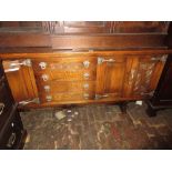 Reproduction oak dresser with boarded shelf back above drawers and cupboards