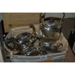 Four piece half fluted design plated tea service including spirit kettle together with two plated