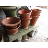 Group of six various terracotta garden planters by Whichford