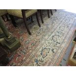 Late 20th Century Sarouk carpet with a medallion and all-over stylised floral design on a rose